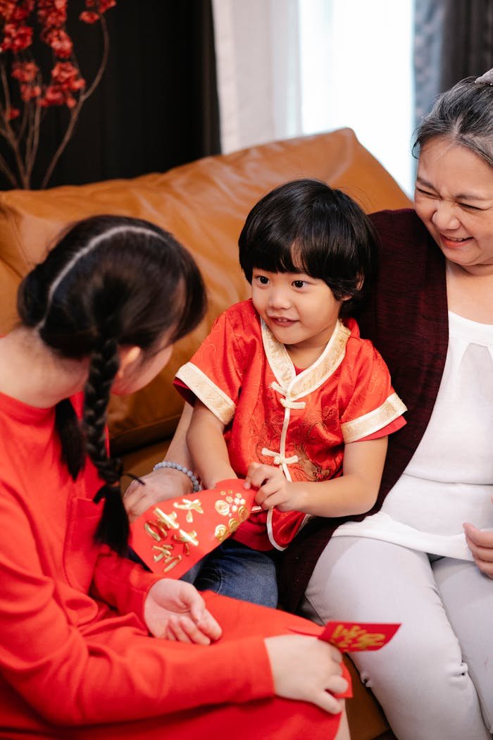 Happy family celebrating Chinese New Year with red envelopes and smiles.